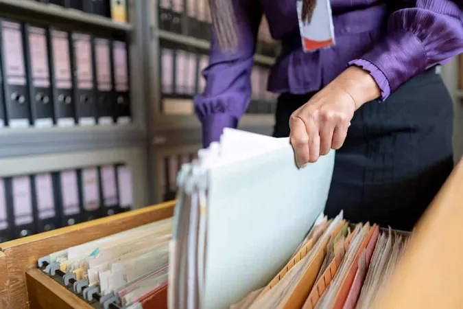 Midsection Woman Holding Documents Office X - Certified Records Manager study guide