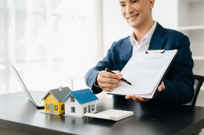 Real Estate Broker Agent Presenting Consult Customer Decision Making Sign Insurance Form Agreement Home Model Concerning Mortgage Loan Offer Office 1 X - Certified Residential Manager study guide
