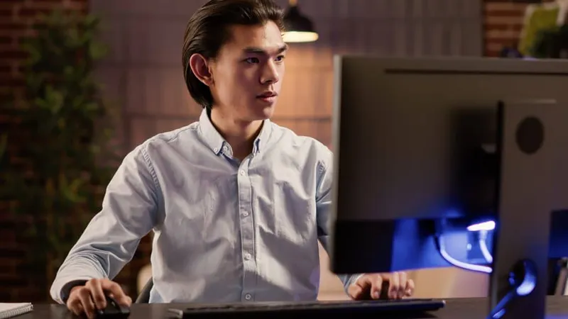 Focused Asian Man Working Commercial Report Website Using Computer Create Solution Economic Plan Doing Paperwork Writing Email Executive Startup Business X - ServiceNow System Administrator Certification study guide