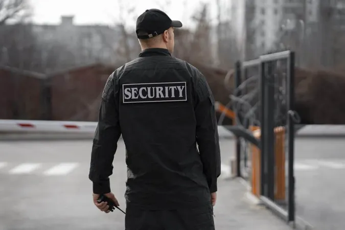 Portrait Male Security Guard With Barbed Wire Fence 2 X - Certified Security Supervisor study guide