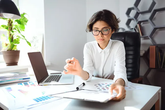 Young Beautiful Businesswoman Sitting Workplace Office - Certified Tax Professional study guide