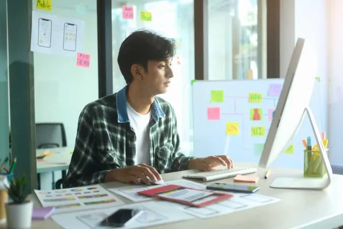 Young Designers Working New Mobile Application Interface Design Computer Monitor X - Certified Disciplined Agile Coach study guide