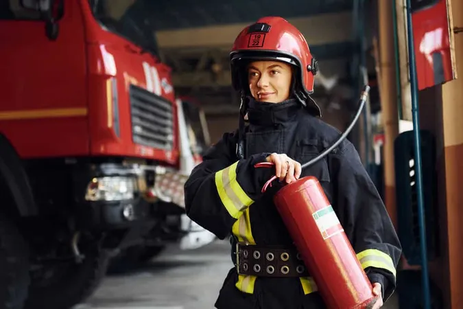 Holds Extinguisher Hands Female 1 1 - Fire Safety study guide