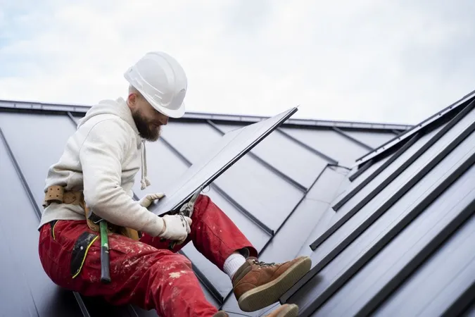 Man With Helmet Working Roof Full Shot 1 X - GAF Certified Roofing Contractors study guide