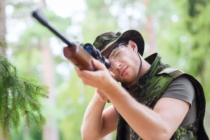 Hunting War Army People Concept Young Soldier Ranger Hunter With Gun Aiming Shooting Forest X - Hunter Safety Certification study guide