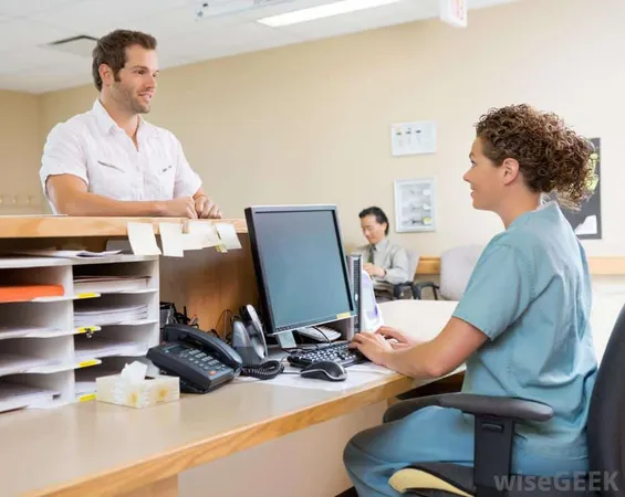 Woman In Scrubs Working At Computer Near Counter And Man - Health Unit Coordinator study guide