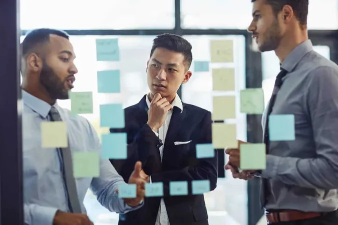 Make It Happen Mindset Shot Group Young Businesspeople Having Brainstorming Session Together Modern Office 1 X - Lean Management Certification study guide