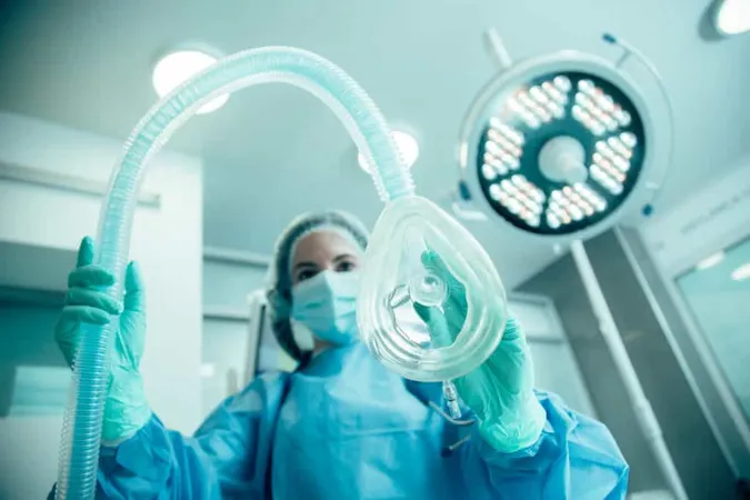 Female Doctor Standing Operating Room Getting Ready Putting Her Patient Narcosis X - Maintaining Anesthesia Certification study guide