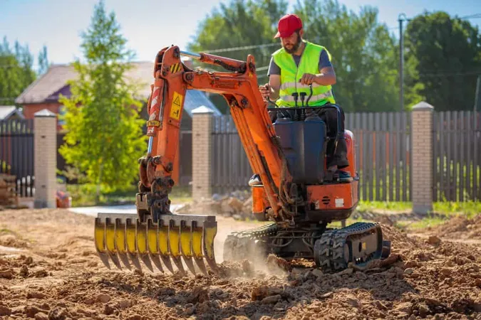 Rear View Man Working Construction Site X - Mini Excavator Operator Certification study guide