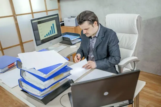 Young Businessman Working From His Office Concept Hard Work X - Master Municipal Clerk Certification study guide