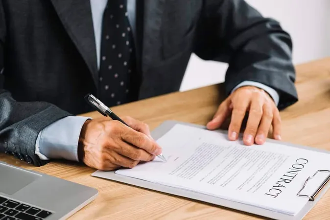 Male Lawyer Signing Contract Wit - Notary study guide