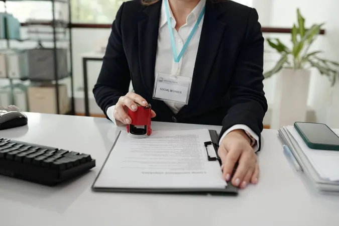 Social Worker Putting Stamp Docu - Notary study guide