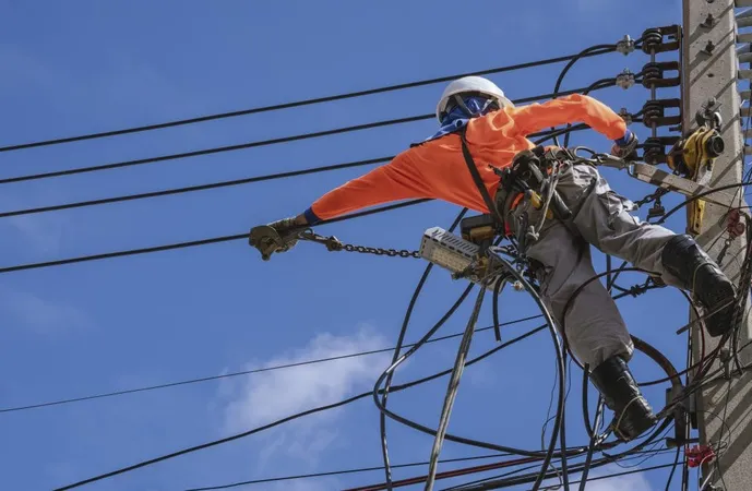 Electrician With Work Tools Is Installing Cable Lines Electrical System Electric Power Pole X - Philadelphia Electric Company Certified Professional study guide
