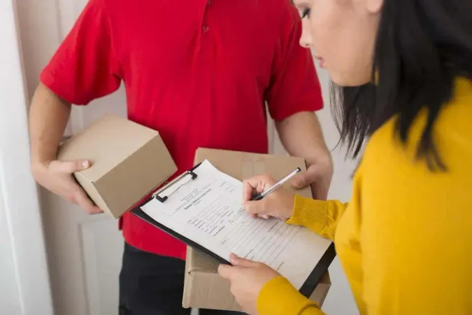 Side View Woman Signing Delivery - Postal Exam study guide