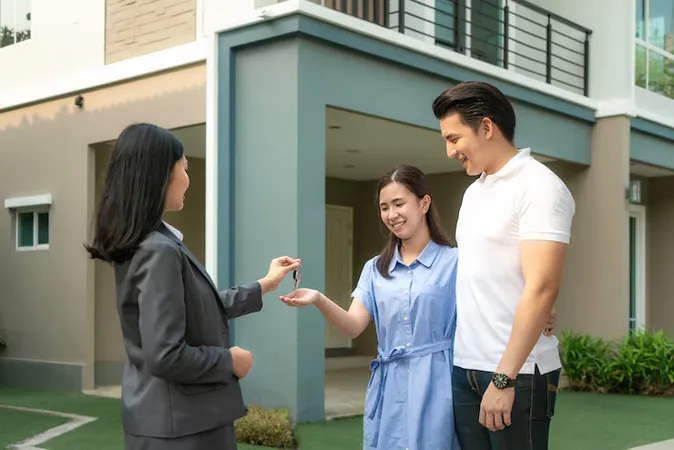Happy Young Couple Take Keys New Big House From Real Estate Agent - Certified Residential Accredited Appraiser study guide