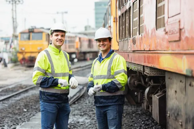 Portrait Engineer Train Service Team With Old Broken Diesel Train Park Railway Depot Happy Smiling Standing Together X - Railroad Engineer Certification study guide