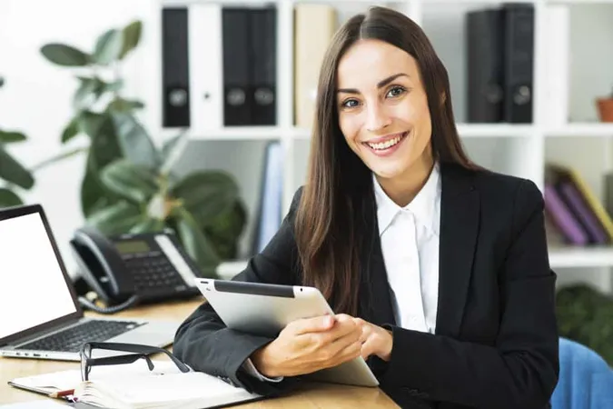 Portrait Young Businesswoman Sitting Desk Holding Digital Tablet Her Hand X - Registered Financial Consultant study guide