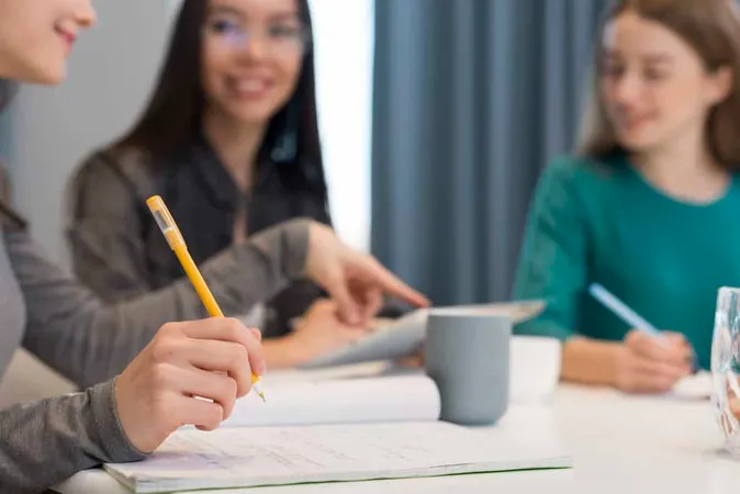 Close Up Adult Women Working Tog - TOEFL study guide